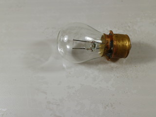 electric incandescent light on white table
