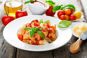 Pasta with spicy tomato sauce, parmesan and basil.