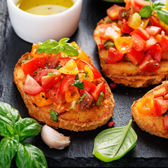 Italian bruschetta with chopped tomatoes and basil   on grilled crusty bread.