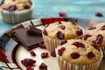 Platter of homemade vegan pumpkin muffins with chocolate and dried cherries