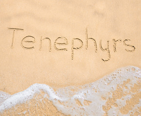 The word Tenephyrs written in the sand on beach
