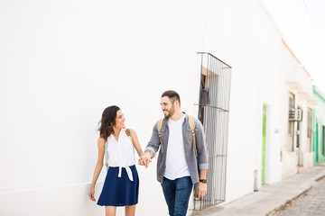 Fototapeta premium Cute couple walking and looking each other
