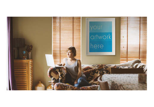 White Framed Poster with Laptop User at Home Mockup