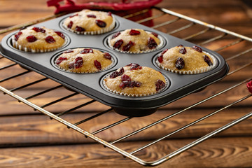 homemade muffins with dried cherry in bakeware