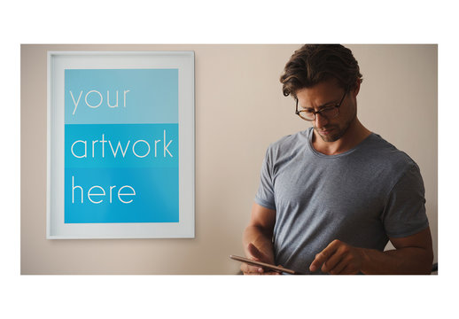 White Framed Poster with Man Using Smartphone Mockup