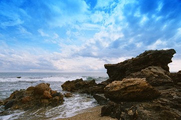 Fototapeta na wymiar sea storm beach clouds rock morning landscape