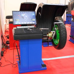 Equipment for service and repair of motorcycles - tire machine for balancing motorcycle wheels (balancing stand)