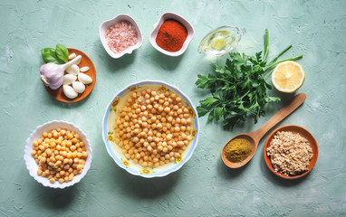Ingredients for traditional hummus on the kitchen table. Top view.