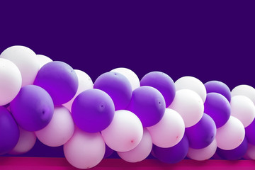 Bundle of balloons pink and purple background