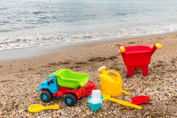 Fototapeta na wymiar toys in the sand at the beach