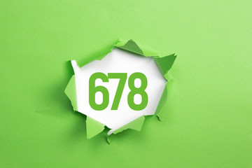 gruene Nummer 678 auf gruenem Papier