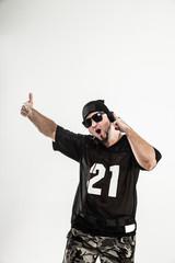 portrait of a badass rapper with headphones on a white backgroun