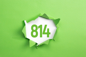 gruene Nummer 814 auf gruenem Papier