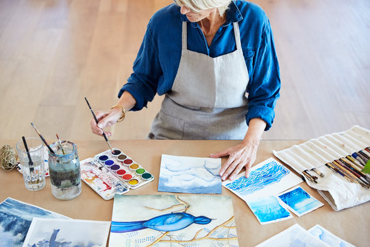 Senior woman doing her watercolor artwork