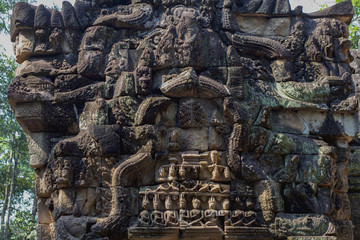 Fototapeta na wymiar Ancient stone carving of Ta Prohm temple, Angkor Wat complex, Cambodia. Carved gate of temple ruin.