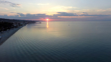 Fototapeta na wymiar flight over the sea at sunset
