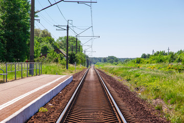 Fototapeta na wymiar railway lines under the blue sky