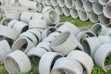 stacked of concrete, cement pipes. concrete pipes for irrigation at construction site