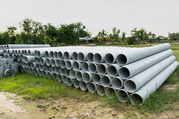 stacked of concrete, cement pipes. concrete pipes for irrigation at construction site