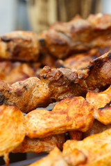 Appetizing meat grilled on skewers. Cooking shashlik. Grilling pork on coal
