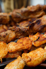 Appetizing meat grilled on skewers. Cooking shashlik. Grilling pork on coal