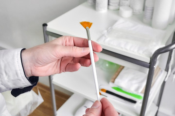 Female hands and Fan brush from nylon