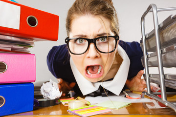 Depressed businesswoman sitting at desk