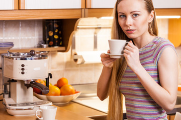 Happy woman holding cup of tea of coffee