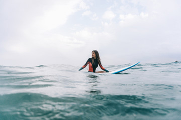 Girl in water on board