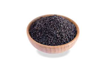 black sesame in wooden bowl isolated on white background with clipping path