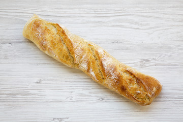 Top view italian baguette on white wooden background. From above.