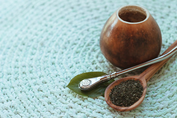 Calabash with mate tea on knitted mat