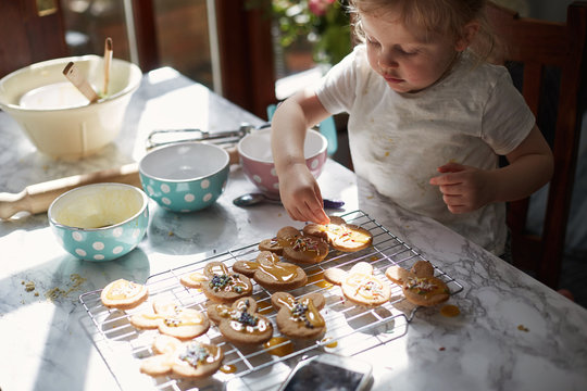 Child baking biscuits