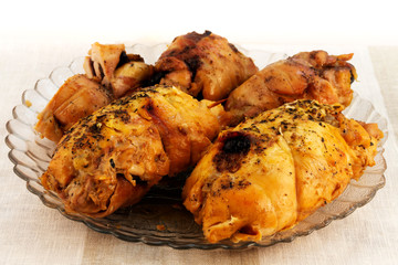 Meat rolls baked in the oven, laid on a glass plate.