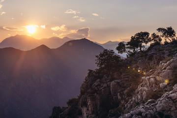 Naklejka premium Evening view of rocks on the top of mountain above Kotor town in Montenegro