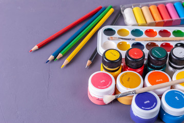plastic jars with acrylic paint, watercolors and colored pencils