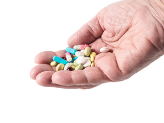 Female palm with pills isolated on white background