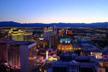 illuminated cityscape against clear sky at night