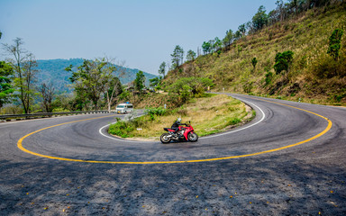 Riding a motorcycle on the road, Thailand.