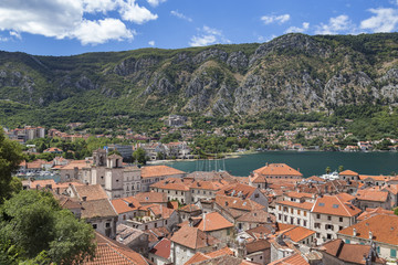 Fototapeta na wymiar Dramatic mountains behind the world famous walled city of Kotor, Montenegro.