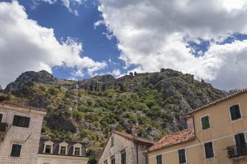 Naklejka premium Buildings and Mountain above Kotor, Montenegro.