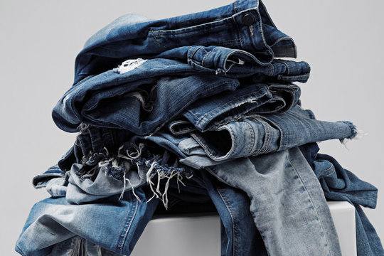 a pile of blue jeans