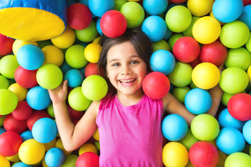 Little Girl Playing At Playground Outdoors In Summer