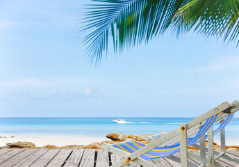 Comfortable beach chair at sea shore. Vacation concept.Sand beach and Beautiful sea background in summer.