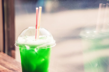 green cocktail with ice. The sour and thirst-quenching drink in summer weather