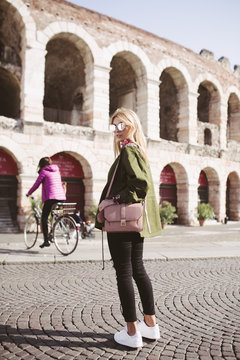 Fashion blogger in front of the Arena in Verona