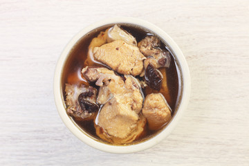  Black garlic chicken soup on the table 