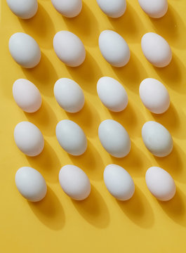 Eggs, neat eggs arranged on a yellow background