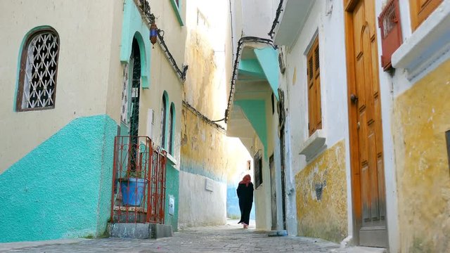 Woman Passing Though on the Streets of Morocco