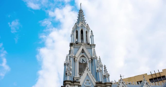 Church Ermita in Cali on sunny day with blue sky and a view clouds showing in a hyperlapse